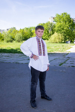 young boy in a traditional Ukrainian embroidered shirtの写真素材