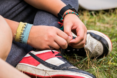 children's hands with patriotic bracelets in the forest in the touristの写真素材