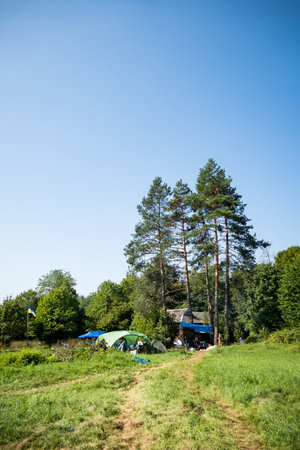 Ukrainian flag and fabric tents high in the mountainsの写真素材