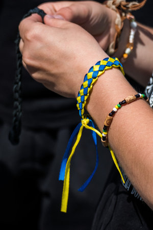 children's hands with patriotic bracelets in the forest in the touristの写真素材