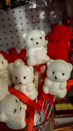 souvenir bears on foam sticks, white with sparkles, red, velvet coating, decorative elements, blanks, for holidayの写真素材
