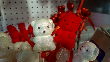 souvenir bears on foam sticks, white with sparkles, red, velvet coating, decorative elements, blanks, for holidayの写真素材
