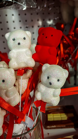 souvenir bears on foam sticks, white with sparkles, red, velvet coating, decorative elements giftsの写真素材