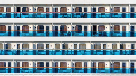 Cruise liner deck of blue and white colored stripes with people standingのeditorial素材