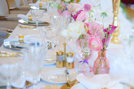 Catering table set service with silverware, napkin and glass at restaurant before party