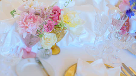 Catering table set service with silverware, napkin and glass at restaurant before party