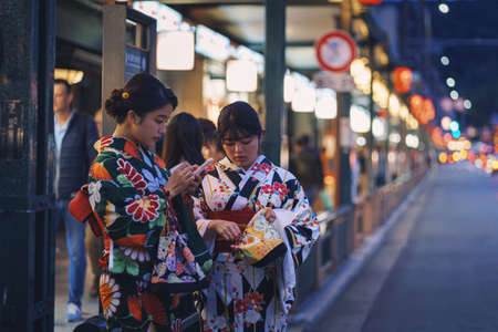 Japanese tourists and national costumes walk on the streets of Kyoto, Japan. Arashiyama is a popular tourist destination.のeditorial素材