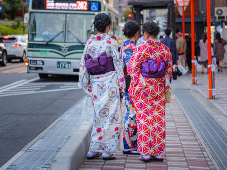 Japanese tourists and national costumes walk on the streets of Kyoto, Japan. Arashiyama is a popular tourist destination.のeditorial素材