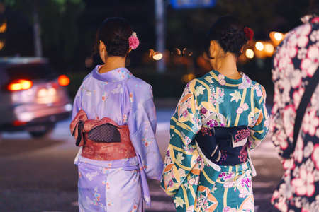 Kyoto, Japan - NOV 11, 2019: Japanese girls in national kimono costumes walk on the Shijo-dori streetのeditorial素材