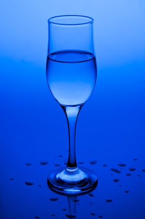 Transparent wine glass filled with water の写真素材