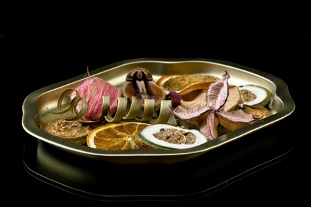 Still life - dried fruits on a golden plate