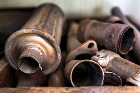 Old and rusty car parts in a junkyardの写真素材