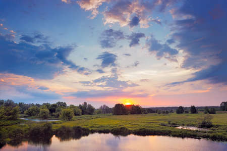 Beautiful Sunrise. Flood waters of Narew river, Poland.の写真素材