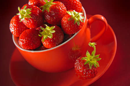 A cup of fresh strawberriesの写真素材