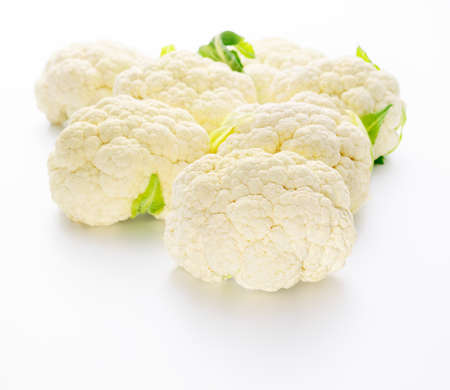 Seven fresh cauliflowers on white backgroundの写真素材