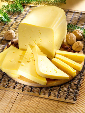 Ararangement with cheese on the kitchen cutting board の写真素材