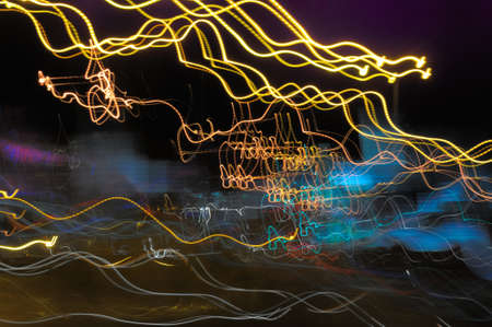 Background with glowing lines on the street by night の写真素材