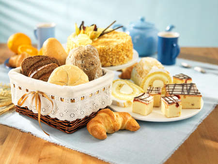 Bread and dessert arrangement on tableの写真素材