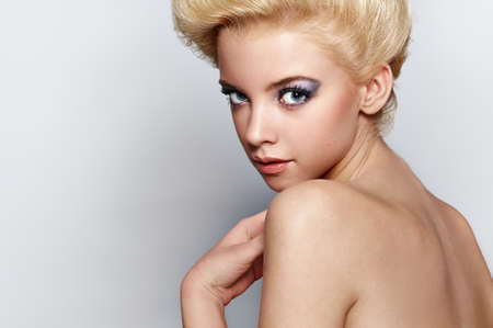 Beautiful sexy blonde woman on gray background の写真素材