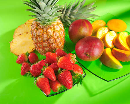 Strawberries, pineapple and mangoes の写真素材