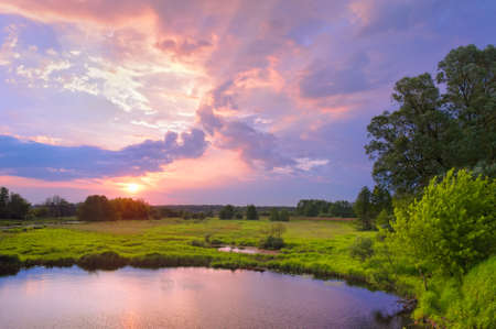 Beautiful sunrise landscape with flood waters of Narew riverの写真素材