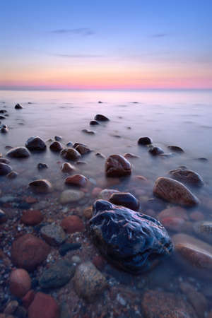 Beautiful seascape with coastal stones in the ocean  The Baltic coast, mediterranean sea, Poland の写真素材