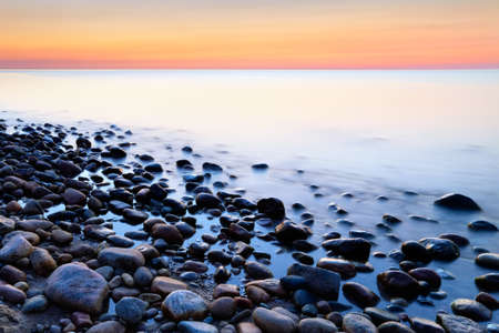 Sunset ocean coastal stones abstract background  Baltic coast, mediterranean sea, Poland の写真素材