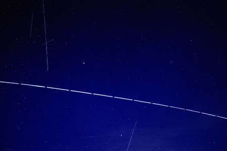 ISS International Space Station and satellites network visible at night sky from Earth. United States Space Force. Radarsat GPS network internet 5G Starlink Space X Crew Dragonのeditorial素材