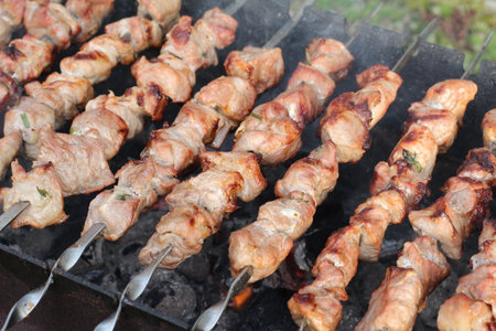 Shish kebab on skewers on the grill close-upの写真素材