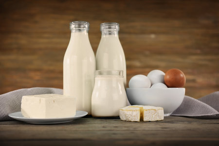 Different dairy products on wooden backgroundの写真素材