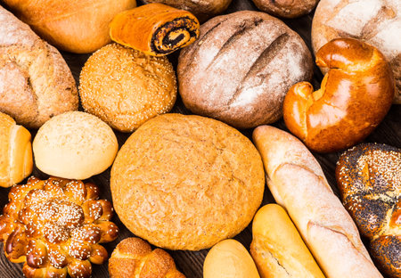 Many mixed breads and rolls shot from above.の写真素材