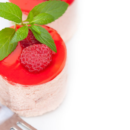 fresh raspberry cake mousse dessert round shape with mint leavesの写真素材