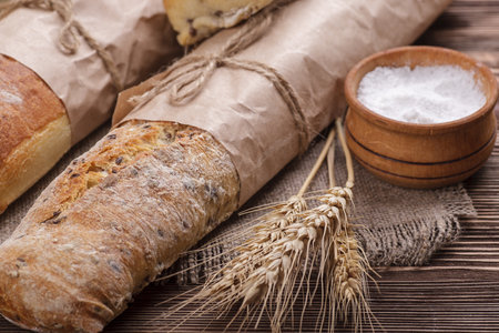 Fresh homemade bread placed on a wooden table
