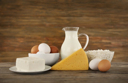 Different dairy products on wooden backgroundの写真素材