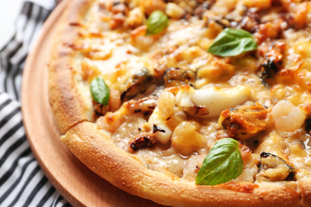 Tasty seafood pizza and napkin, close upの写真素材