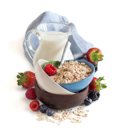Healthy breakfast with muesli and milk isolated on white backgroundの写真素材