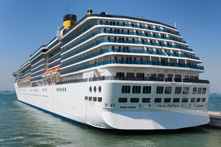 Cruise ship anchored in tropical seaの写真素材