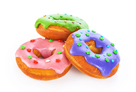 Donuts with colored glaze isolated on white background. Glaze with natural dye.の写真素材