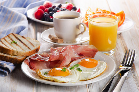 Coffee cup, Two  eggs  and bacon for healthy breakfast.の写真素材