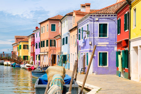 Traditional brightly painted houses and canals on the italian island of Burano near Veniceの写真素材