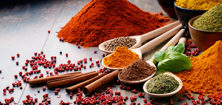 Variety of spices on kitchen table.の写真素材