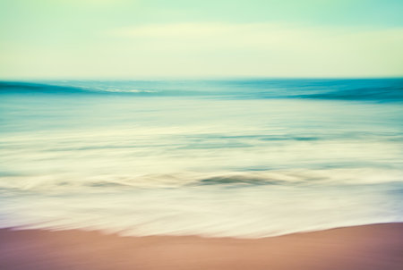 An abstract ocean seascape with blurred panning motion.  Image displays a retro, vintage look with...