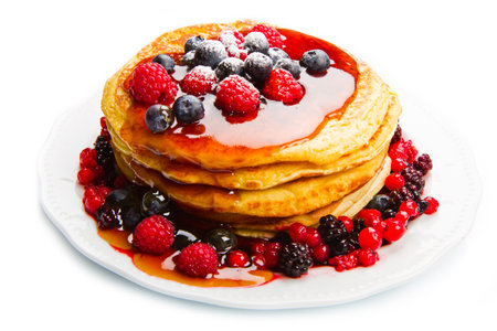 deliciuos pancake with fresh fruit on whiteの写真素材