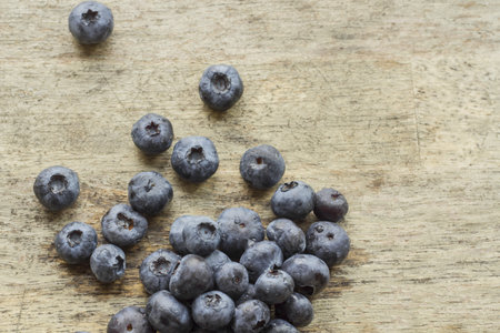 Rustic fresh garden blueberries on grungy wooden tableの写真素材