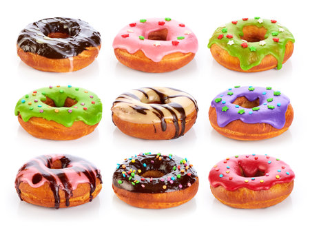 Donuts with colored glaze and chocolate, isolated on white background. Collection.の写真素材