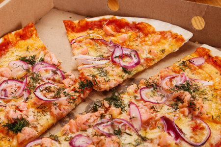 Delicious pizza with salmon and onionの写真素材