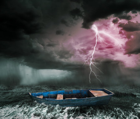 old boat in the stormy oceanの写真素材