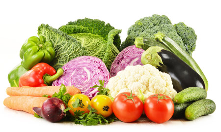 Composition with variety of fresh organic vegetables isolated on whiteの写真素材