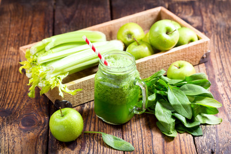 jar of green juice with apple, celery and spinachの写真素材