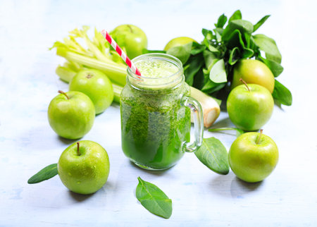 jar of green smoothie with apple, celery and spinachの写真素材